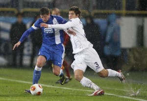 Dnipro Dnipropetrovsk's Yevhen Seleznyov fights for the ball with Fiorentina's Marcos Alonso during their Europa League soccer match at the Dnipro Arena in Dnipropetrovsk